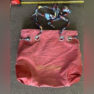 True religion tote bag with ribbon straps.